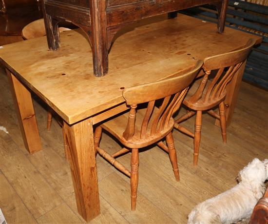 A pine kitchen table and a set of four beech kitchen chairs, 153 x 92cm